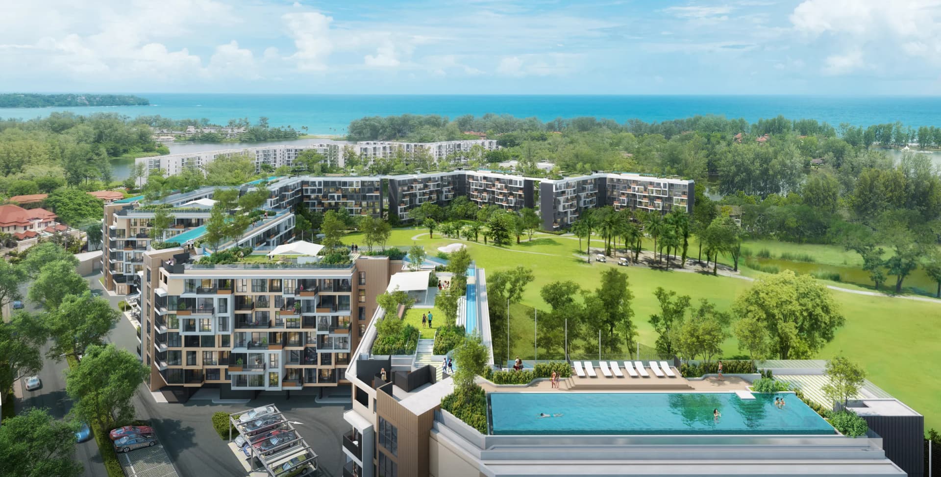 Rendering of a rooftop infinity pool with loungers, the blocks along the golf course and Bang Tao Bay on the horizon
